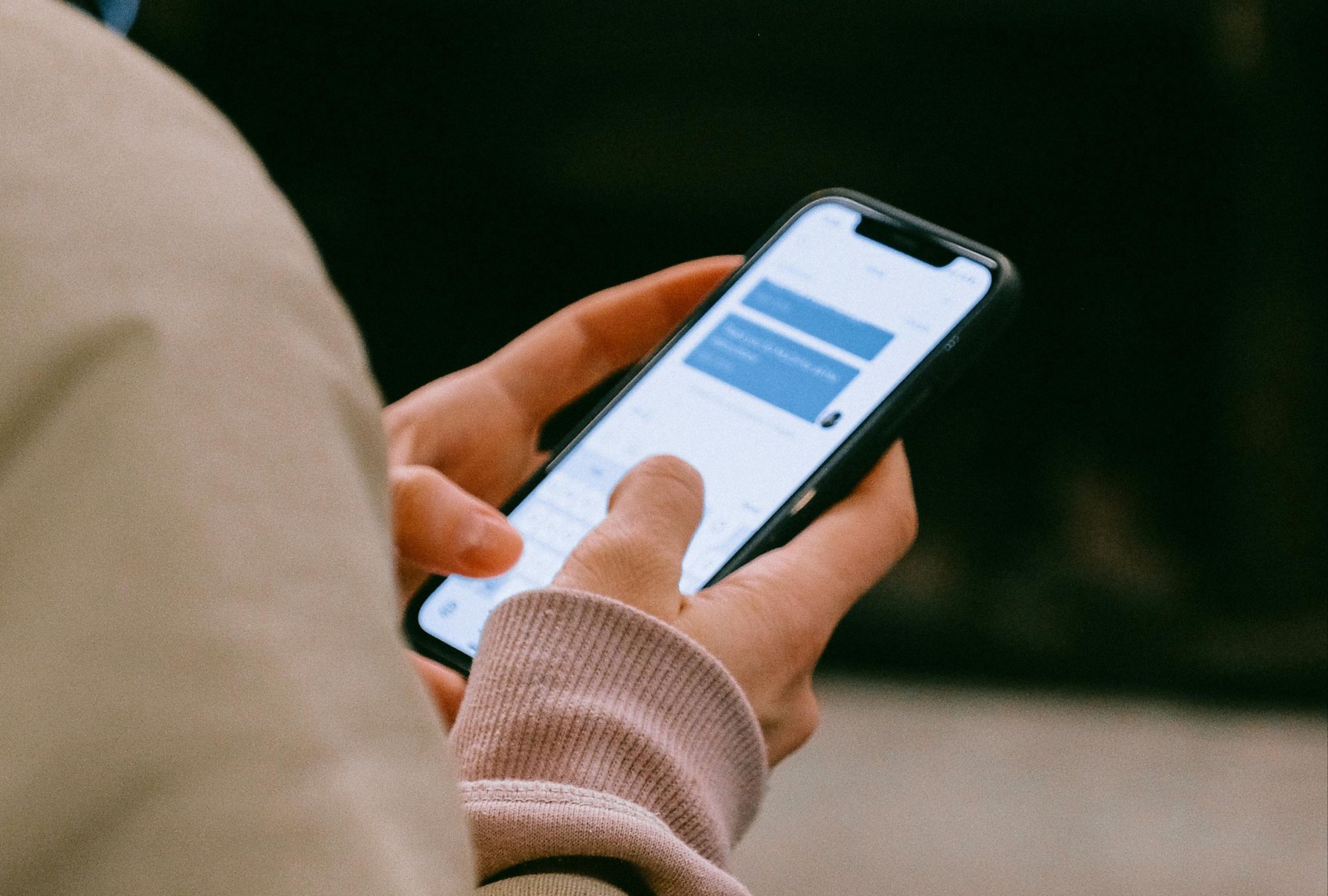 A person on their phone messaging